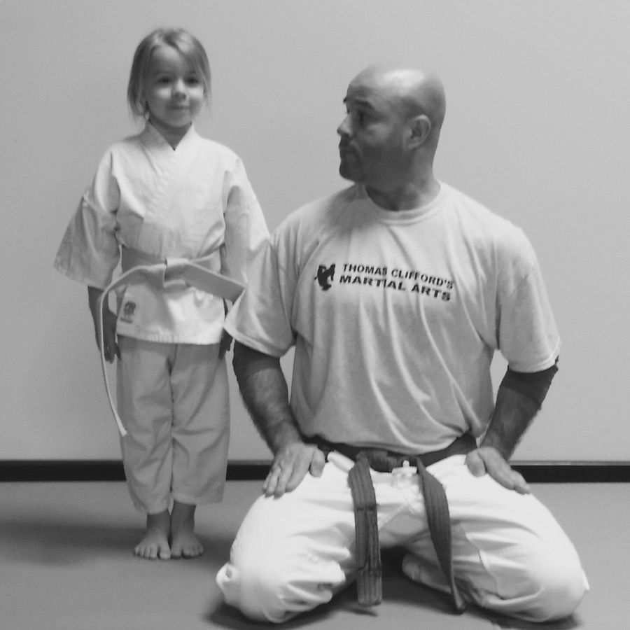 A young student with her instructor at Thomas Clifford's Martial Arts
